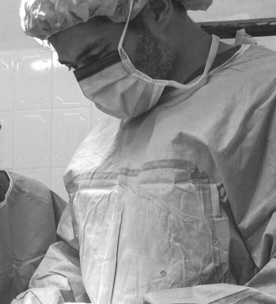 Black and White photo of Dr. Javad Sajan performing feminization surgery